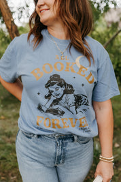 Comfort colors tee in washed denim with 'All Booked Forever' graphic, shown on model – Little Mama Shirt Shop