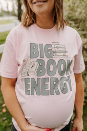 Comfort colors tee in blossom with 'Big Book Energy' graphic, shown on model – Little Mama Shirt Shop