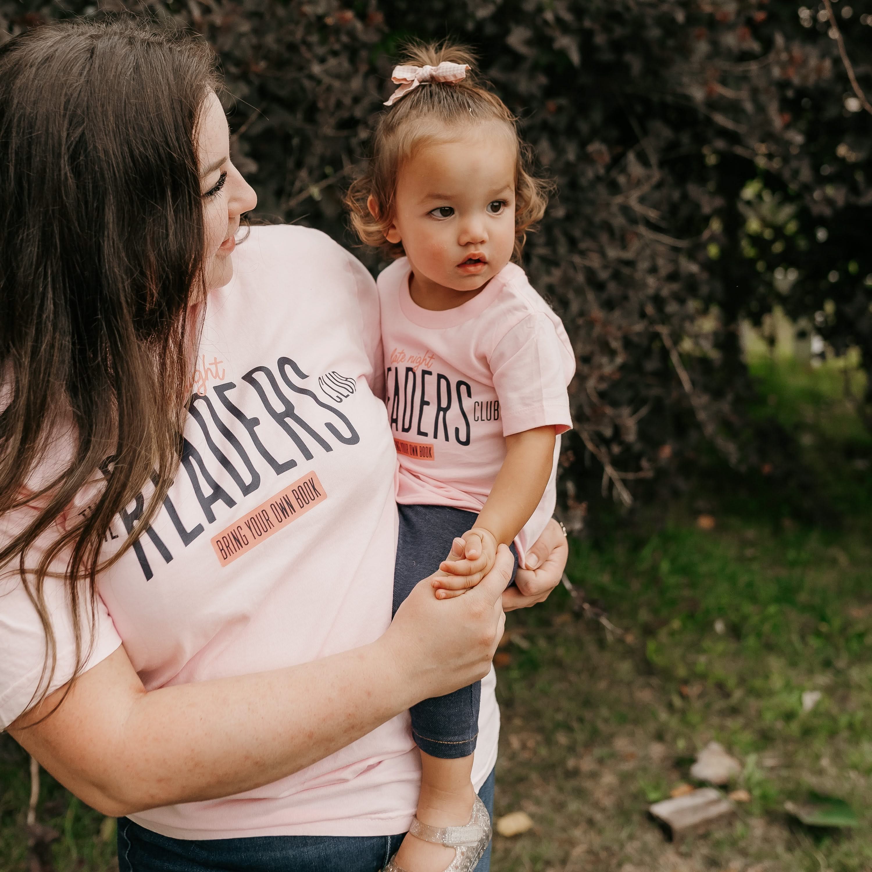 Coordinating mommy and me tees in blossom and ballerina pink with “Late Night Readers Club BYOB” design on models – Little Mama Shirt Shop