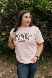 Unisex Comfort Colors tee with “Late Night Readers Club BYOB” design in blossom, on model – Little Mama Shirt Shop