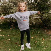 Child’s sweater with “Late Night Readers Club BYOB” design in gray, on model – Little Mama Shirt Shop