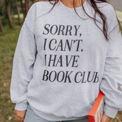 Unisex fleece sweatshirt in ash with “Sorry, I Can't. I Have Book Club.” design, on model – Little Mama Shirt Shop