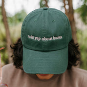 ’47 brand hat embroidered with “Will Yap About Books” design in dark green with pink thread on model – Little Mama Shirt Shop