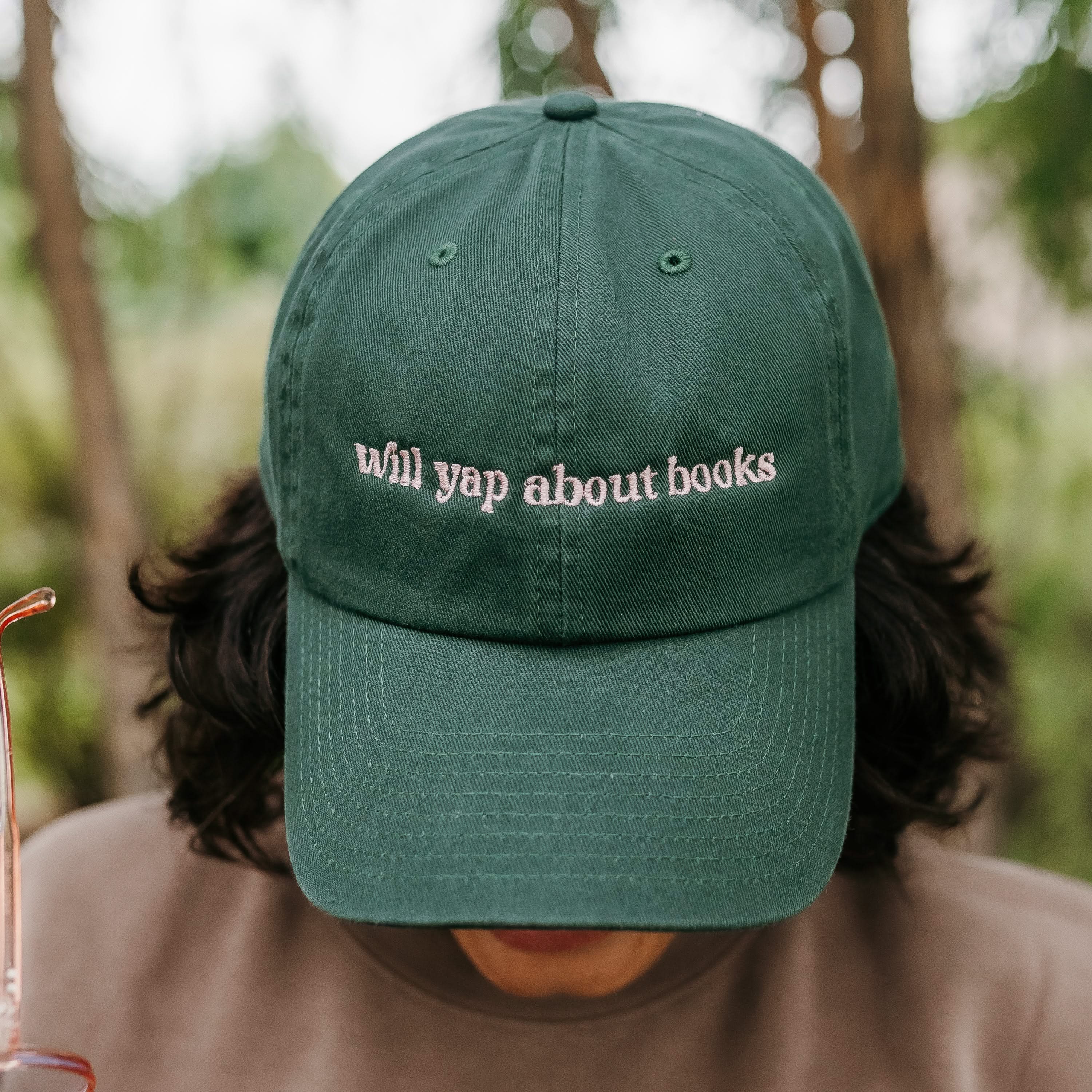 ’47 brand hat embroidered with “Will Yap About Books” design in dark green with pink thread on model – Little Mama Shirt Shop