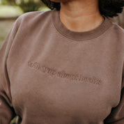 Embroidered “Will Yap About Books” pigment-dyed crewneck in pigment clay - tone on tone on model  – Little Mama Shirt Shop