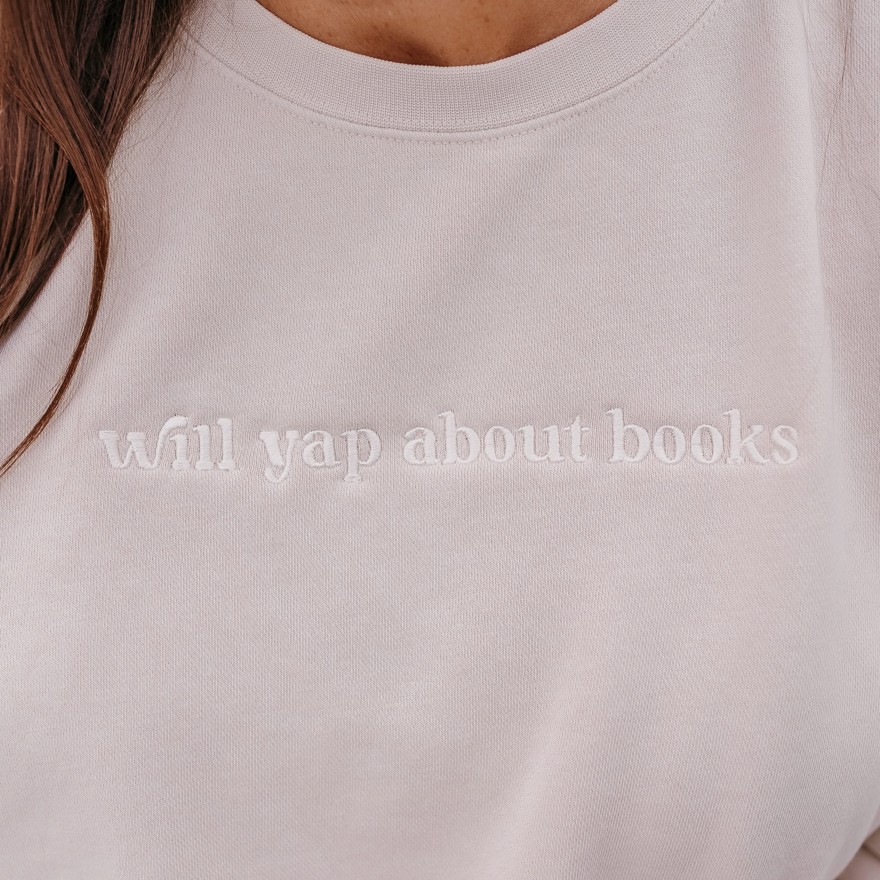 Embroidered “Will Yap About Books” pigment-dyed crewneck in pigment ivory - tone on tone on model  – Little Mama Shirt Shop