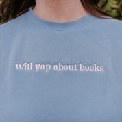 Embroidered “Will Yap About Books” pigment-dyed crewneck in light blue with pink thread on model  – Little Mama Shirt Shop