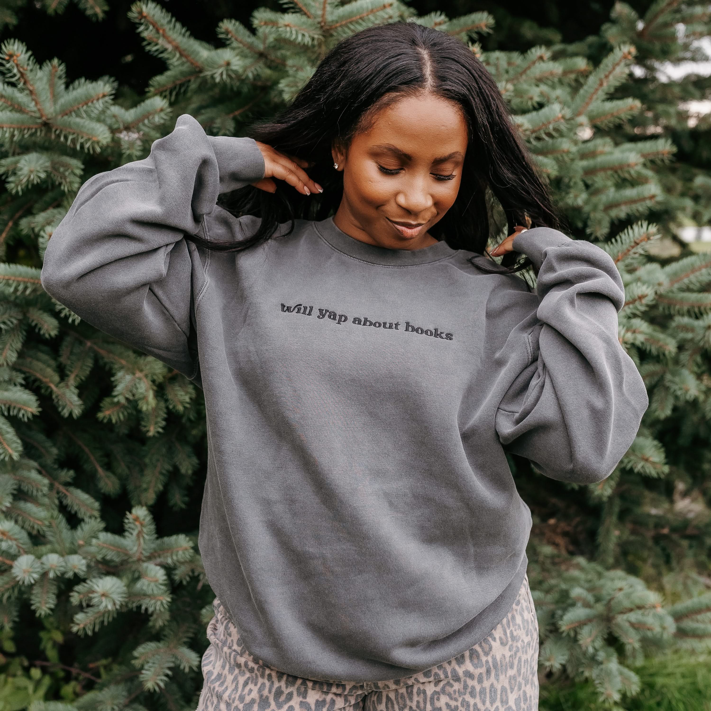 Embroidered “Will Yap About Books” pigment-dyed crewneck in pigment black - tone on tone on model  – Little Mama Shirt Shop