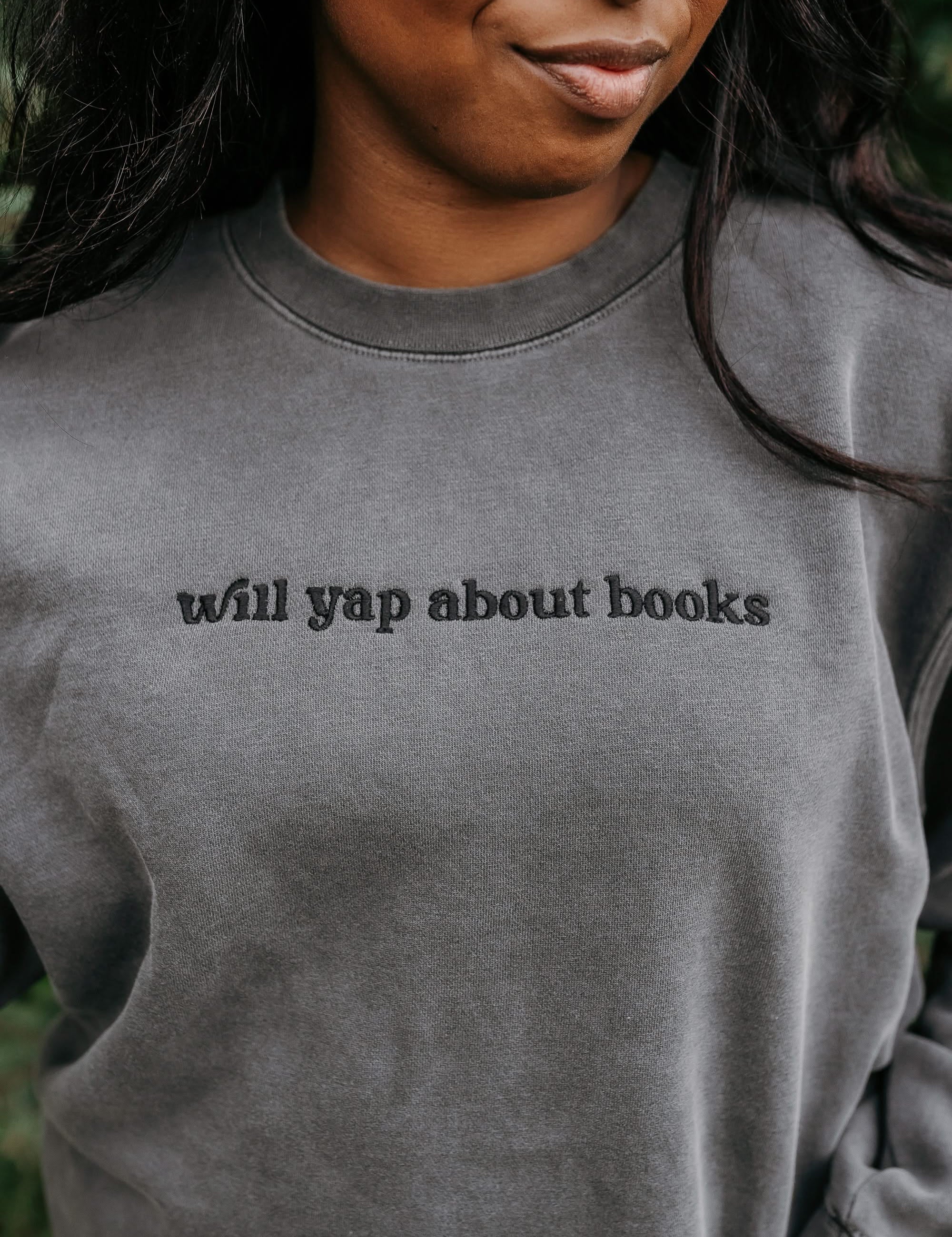 Embroidered “Will Yap About Books” pigment-dyed crewneck in pigment black - tone on tone on model  – Little Mama Shirt Shop