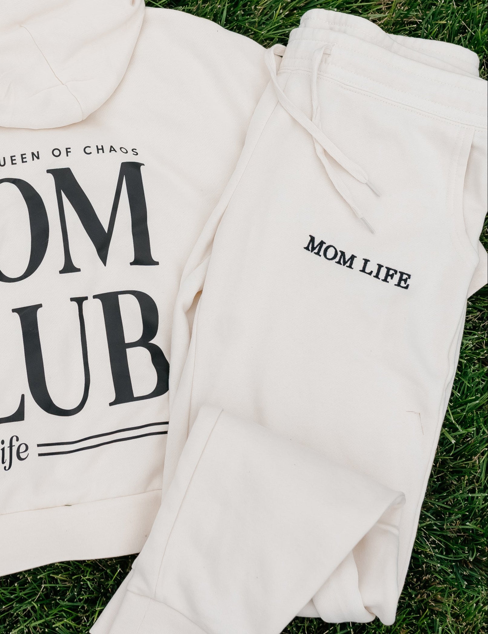 Joggers in bone and black with 'Mom Life' embroidery on flat lay - Little Mama Shirt Shop