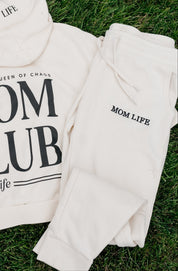 Joggers in bone and black with 'Mom Life' embroidery on flat lay - Little Mama Shirt Shop