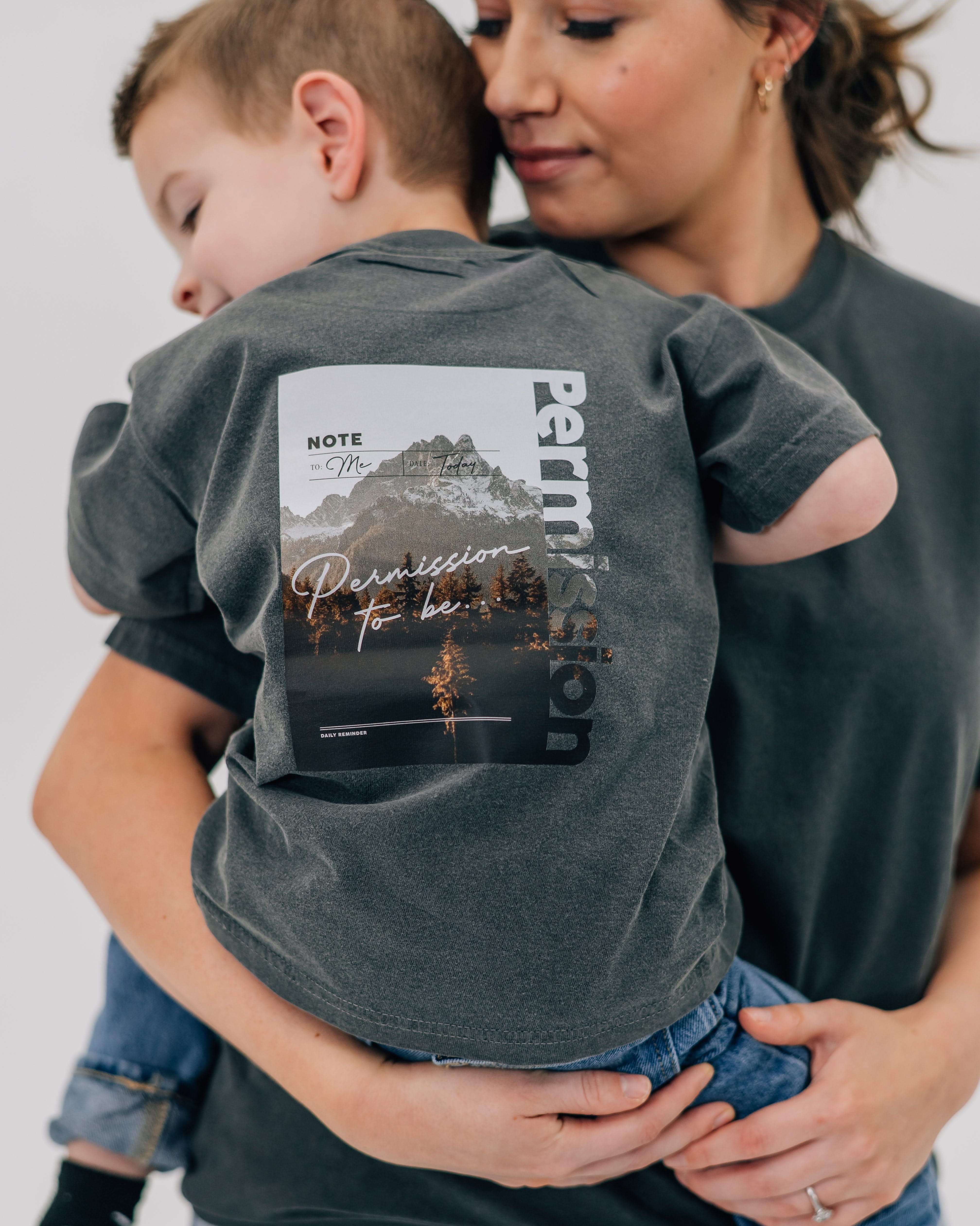 Pepper child comfort colors tee with permission to be mountain graphic on back, seen on model - Little Mama Shirt Shop