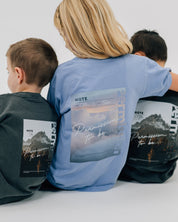 Washed denim and pepper comfort colors tee with permission to be cloud graphic and mountain graphic on back, seen on models - Little Mama Shirt Shop