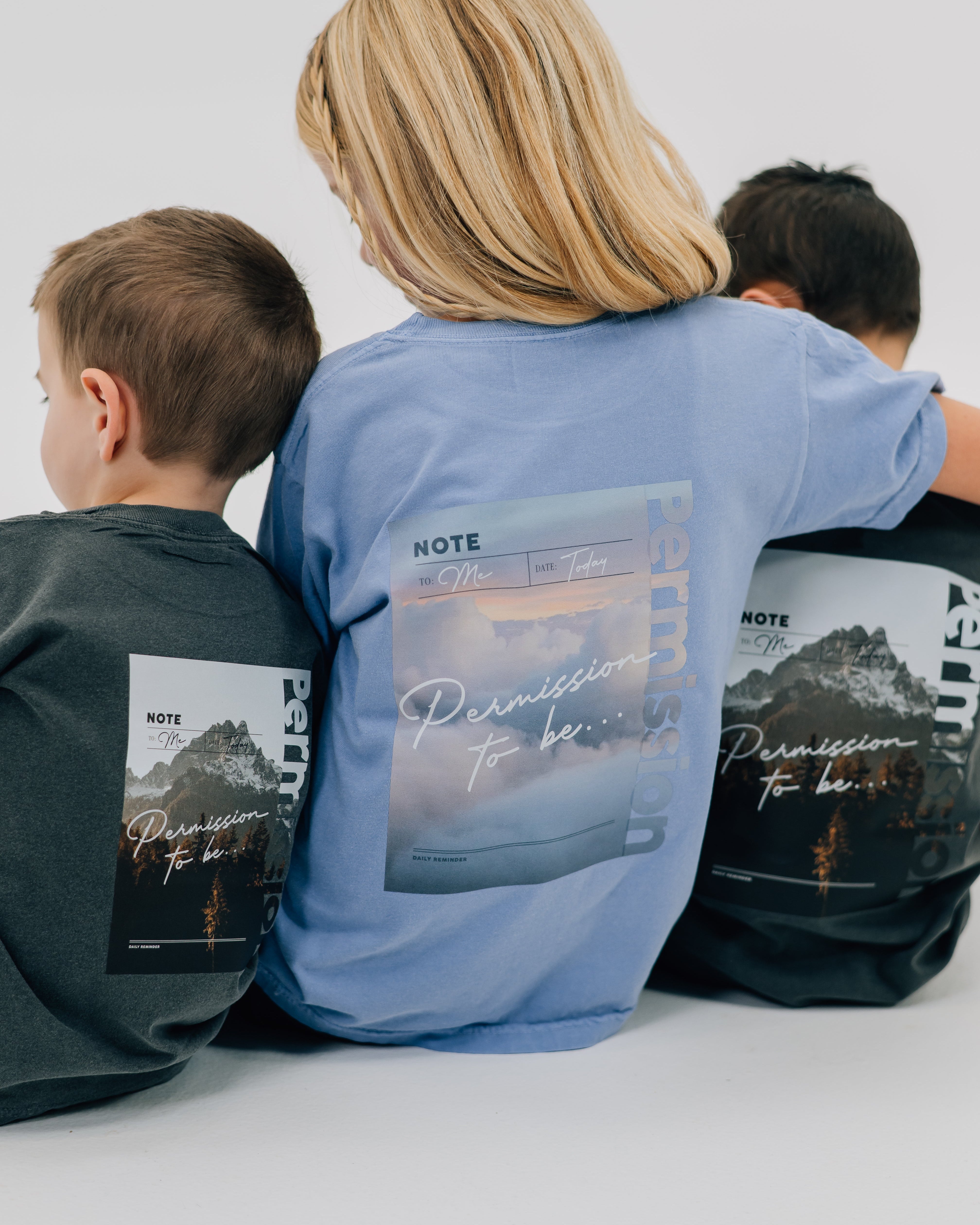 Washed denim and pepper comfort colors tee with permission to be cloud graphic and mountain graphic on back, seen on models - Little Mama Shirt Shop