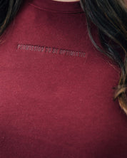 Maroon crewneck with "Permission To Be Optimistic" on chest, shown on model - Little Mama Shirt Shop