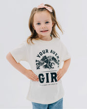 Child tee in natural with "Not Your Average" design on front, shown on model  – Little Mama Shirt Shop