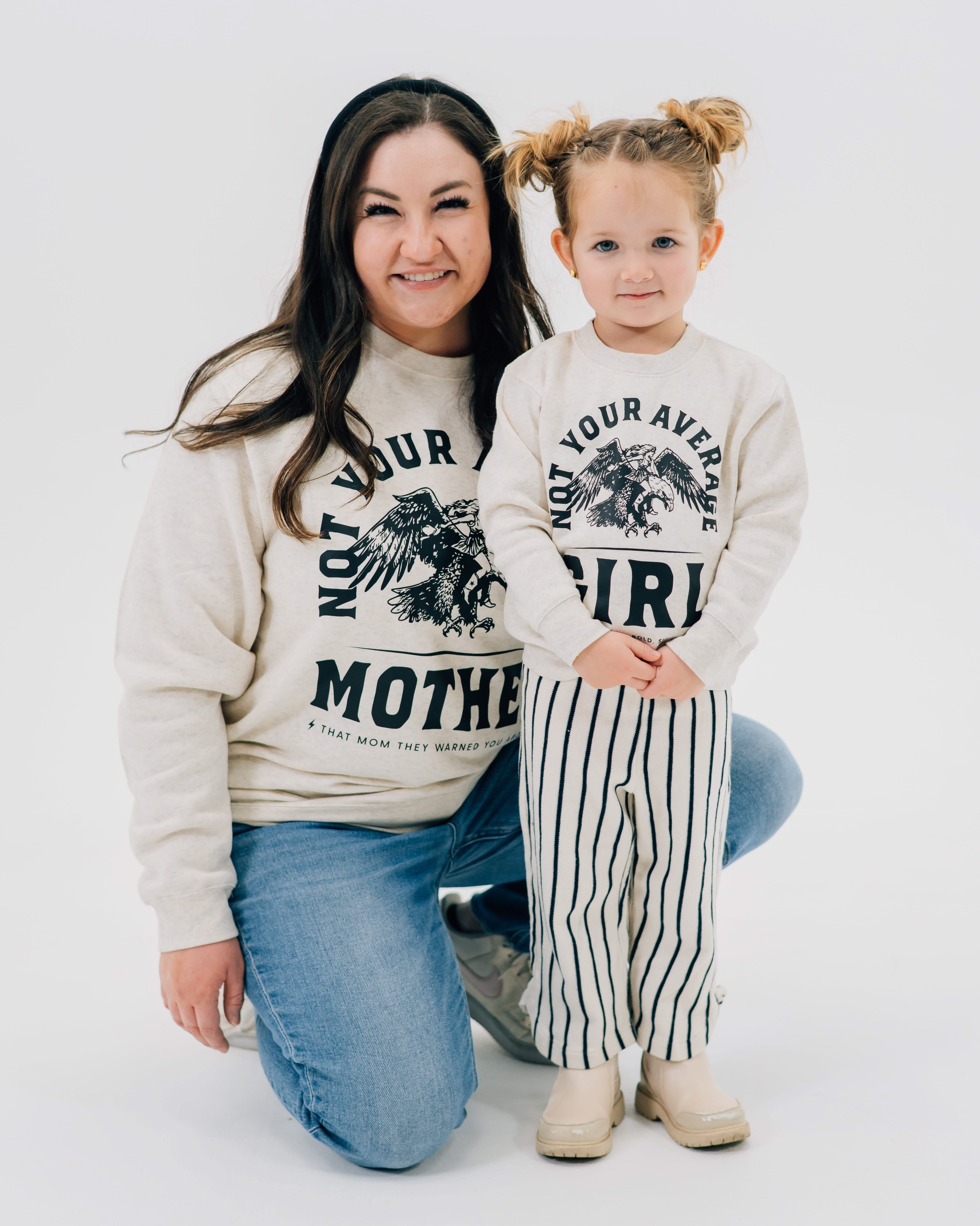 Adult and child sweaters in natural with "Not Your Average" design on front, shown on models – Little Mama Shirt Shop