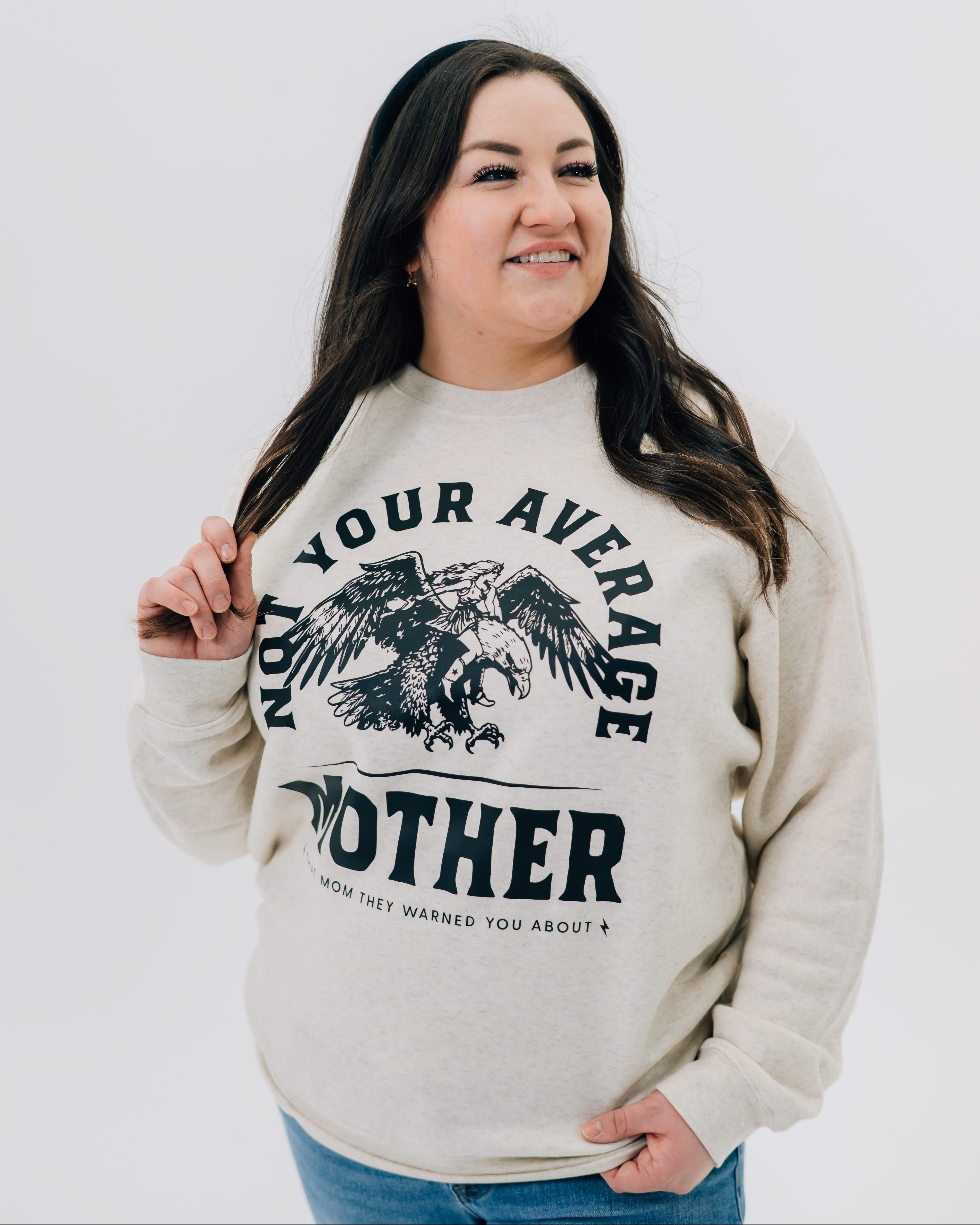 Adult sweater in natural with "Not Your Average" design on front, shown on model – Little Mama Shirt Shop