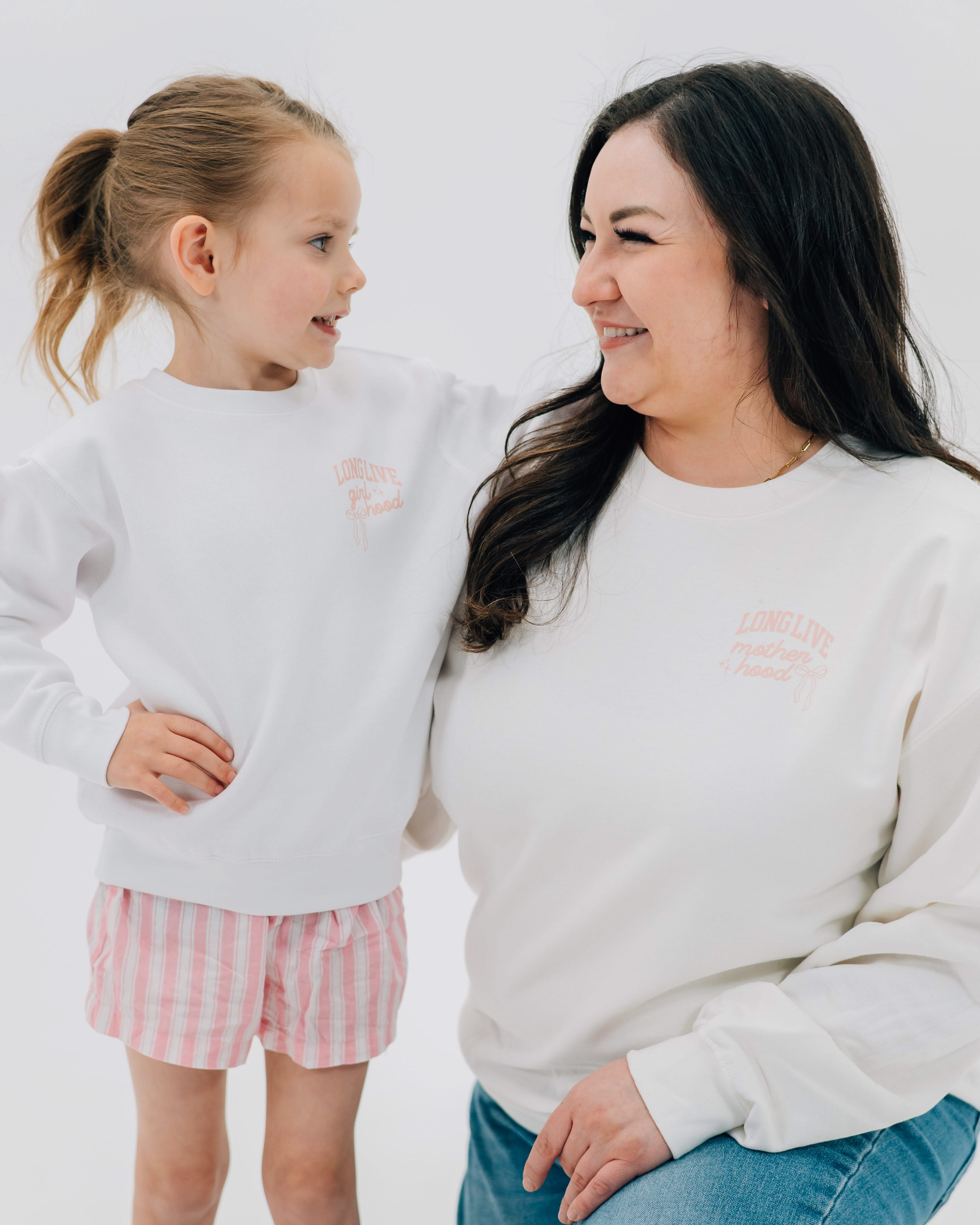 Adult and child sweater in white with "long live" design on front chest, shown on models - Little Mama Shirt Shop