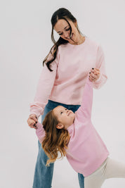 Adult and child sweaters in light pink with "girl gang" design on front chest, shown on models - Little Mama Shirt Shop