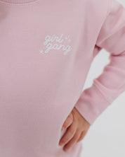 Child sweater in light pink with "girl gang" design on front chest, shown on model - Little Mama Shirt Shop