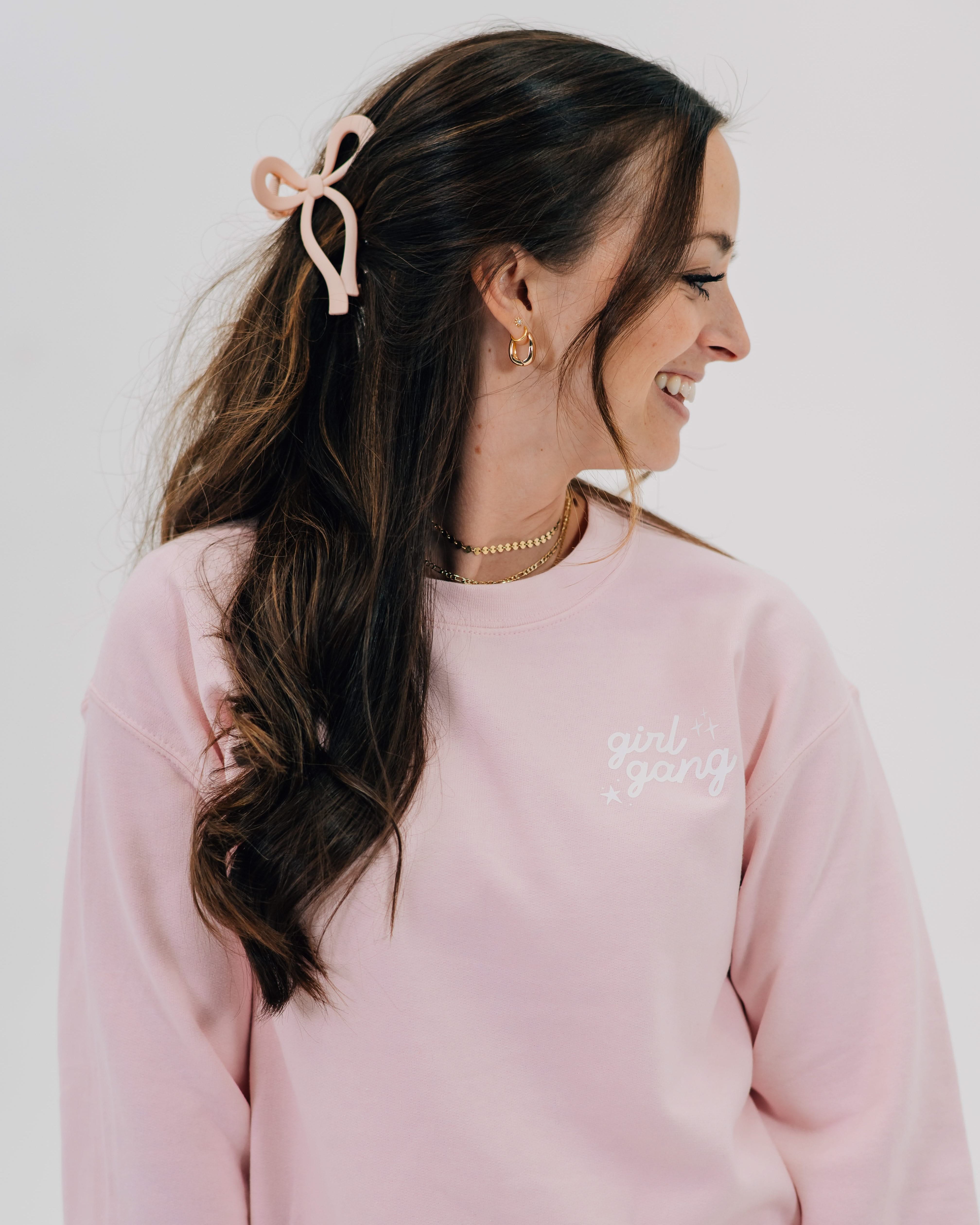 Adult sweater in light pink with "girl gang" design on front chest, shown on model - Little Mama Shirt Shop