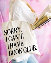 Beige canvas tote bag featuring a 'Sorry, I can't. I have book club.' design on a model - Little Mama Shirt Shop