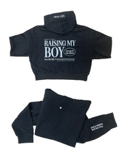 Hoodie front and back view in black with white 'Raising My Boy' graphic on flat lay - Little Mama Shirt Shop