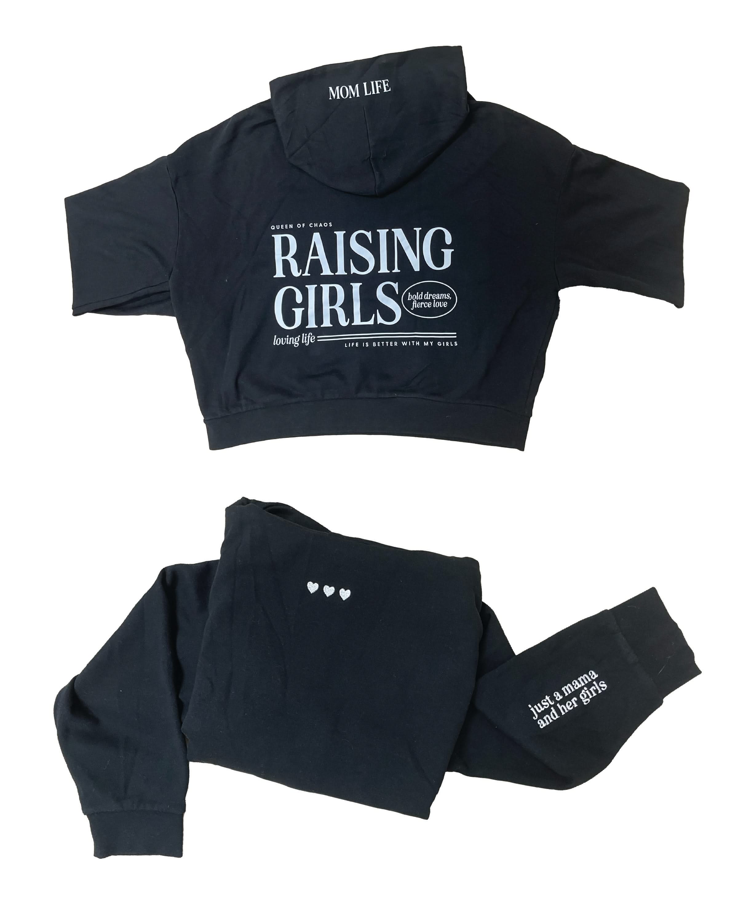 Hoodie front and back view in black with white 'Raising Girls' graphic on flat lay - Little Mama Shirt Shop