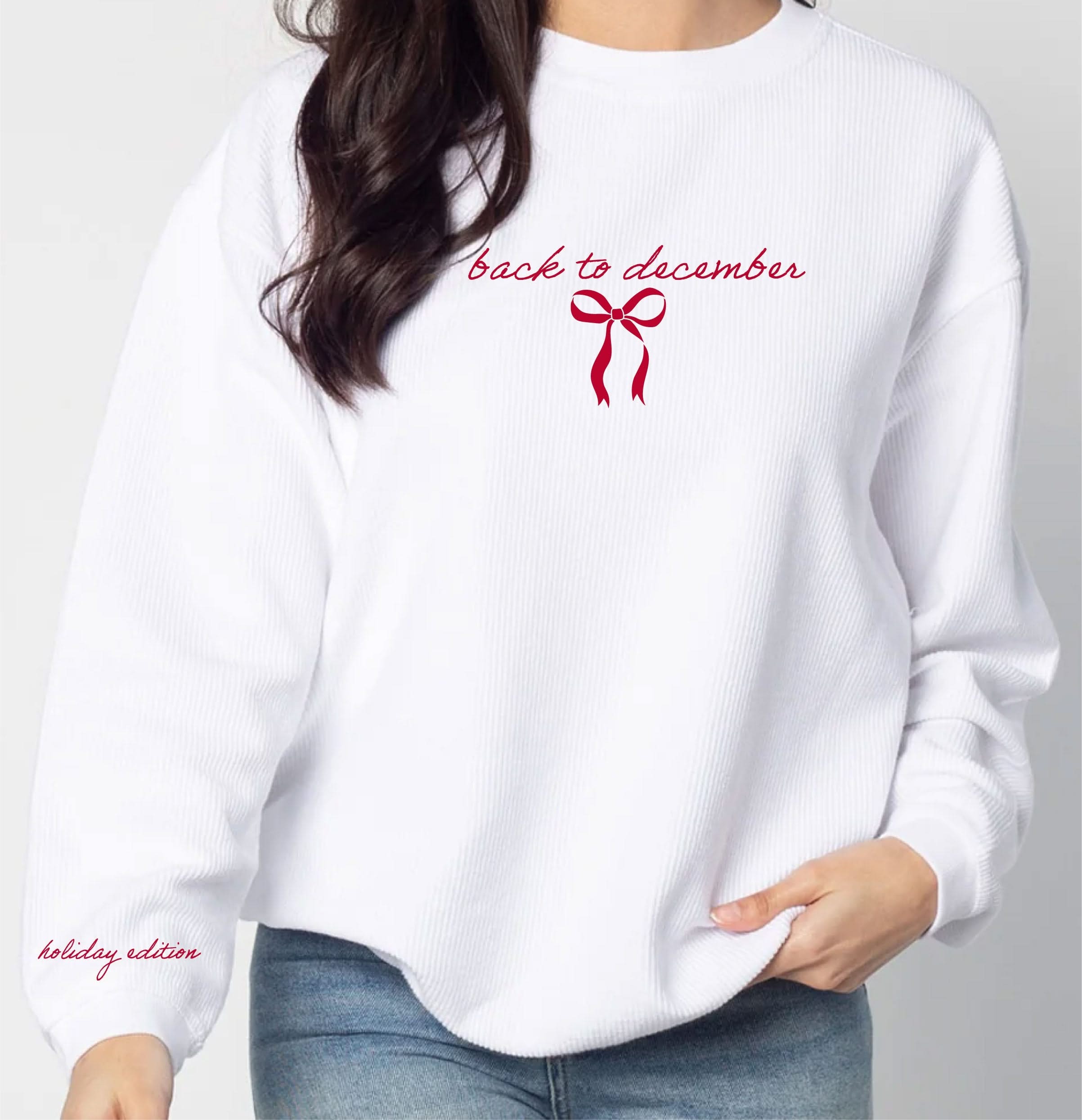 Adult sweater in white with 'back to December' and bow on chest and 'holiday edition' on sleeve, shown on flat lay – Little Mama Shirt Shop