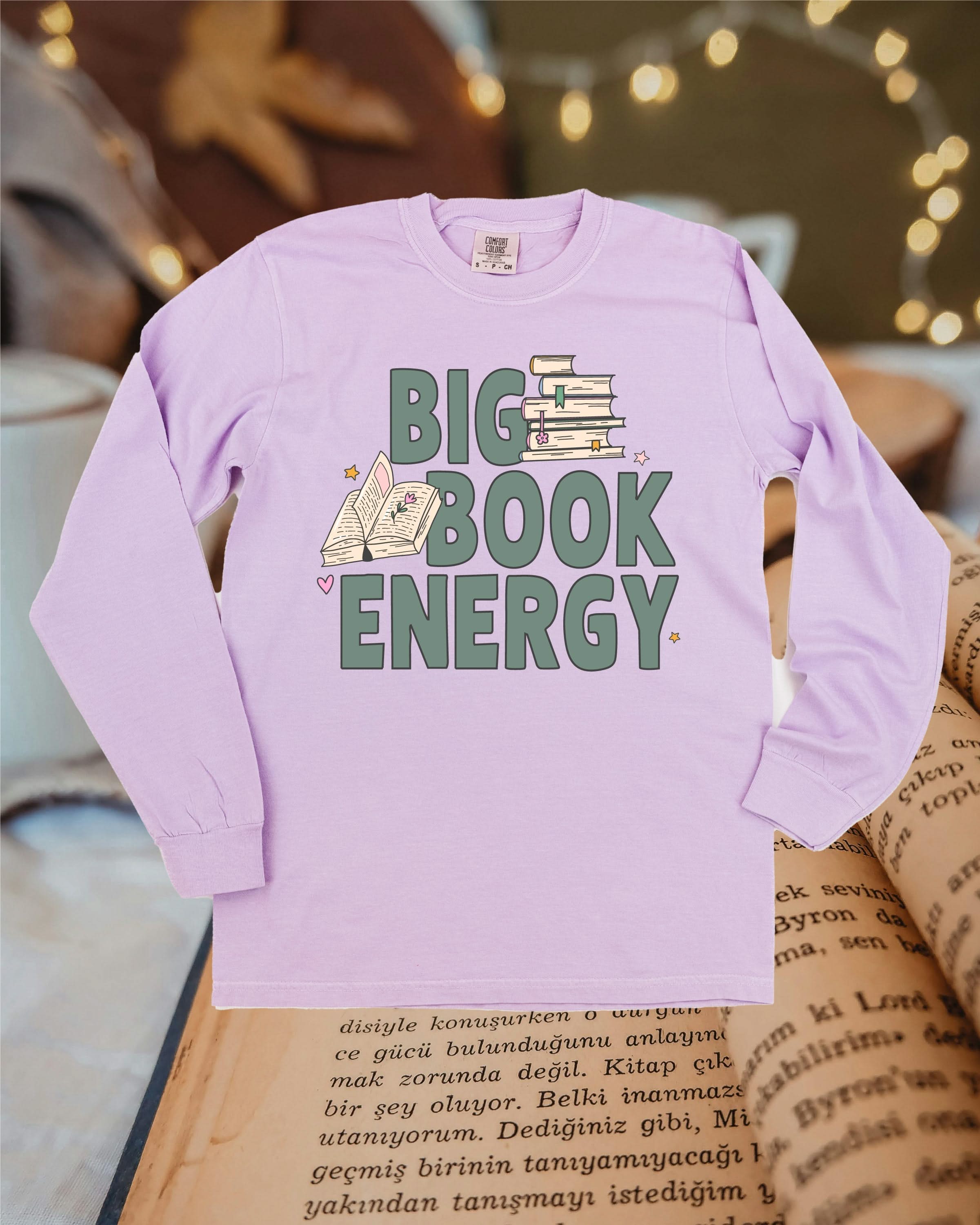 Comfort colors tee in orchid with 'Big Book Energy' graphic, shown on flat lay – Little Mama Shirt Shop