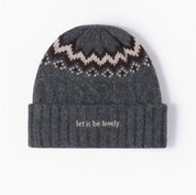 Adult beanie in gray with 'let it be lovely' design on brim, shown on flat lay – Little Mama Shirt Shop