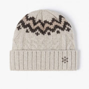 Adult beanie in cream with snowflake design on brim, shown on flat lay– Little Mama Shirt Shop