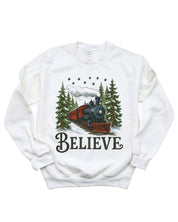Adult Sweater in white with winter train and 'Believe' on chest, shown on model – Little Mama Shirt Shop