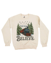 Adult Sweater in sand with winter train and 'Believe' on chest, shown on flat lay – Little Mama Shirt Shop