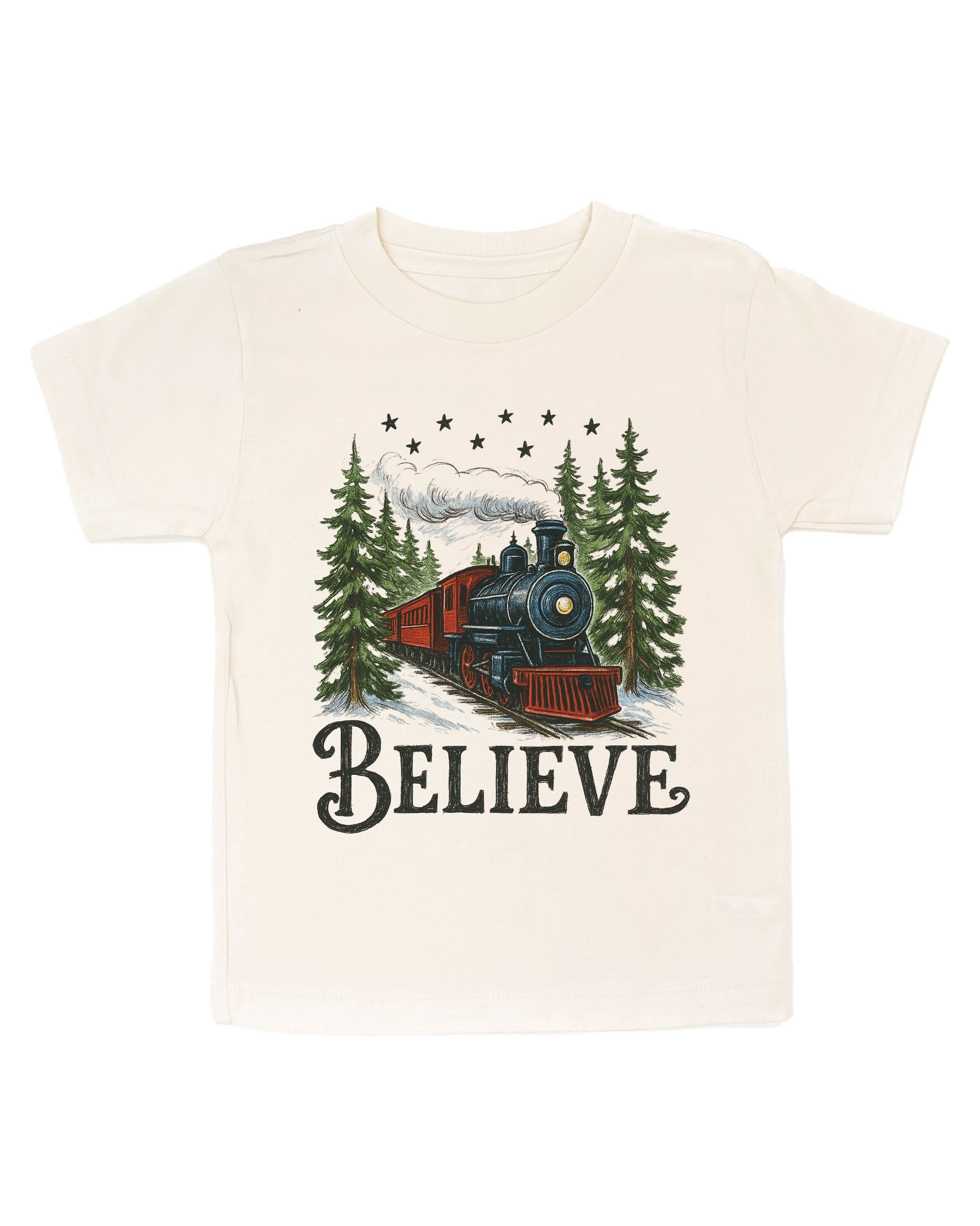 Child tee in natural with winter train and 'Believe' on chest, shown on flat lay – Little Mama Shirt Shop