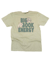 Comfort colors tee in sandstone with 'Big Book Energy' graphic, shown on flat lay – Little Mama Shirt Shop