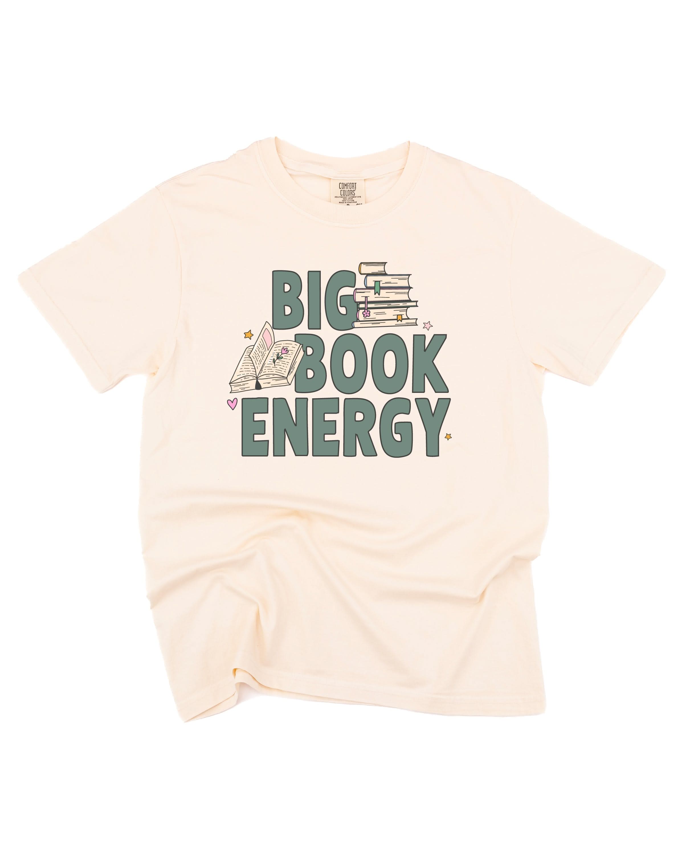 Comfort colors tee in ivory with 'Big Book Energy' graphic, shown on flat lay – Little Mama Shirt Shop