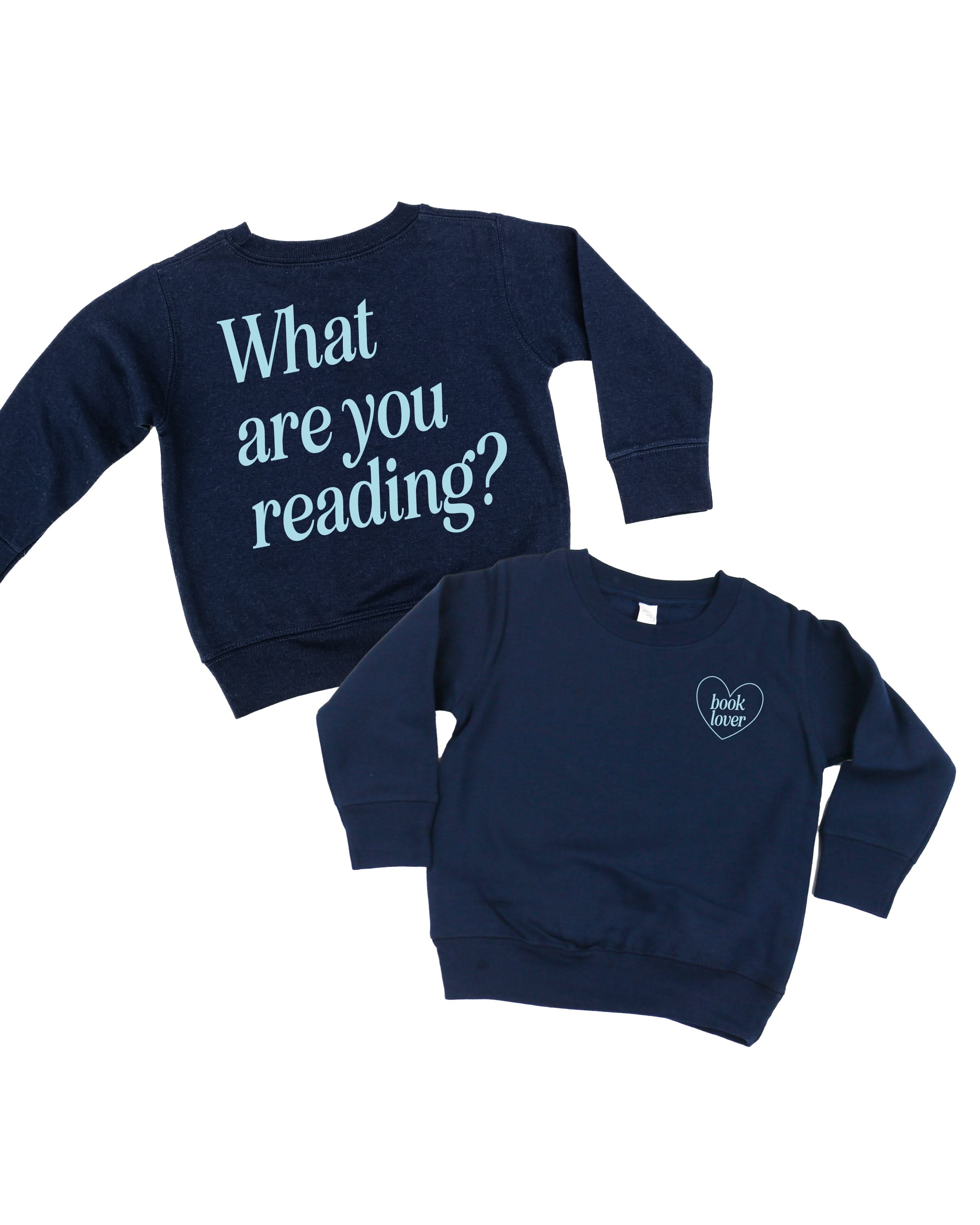 Child sweater in navy w/ light blue detail with a 'book lover' heart graphic on the front and 'What are you reading?' graphic on back, shown on flat lay – Little Mama Shirt Shop