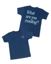 Child tee in navy w/ ice blue detail with a 'book lover' heart graphic on the front and 'What are you reading?' graphic on back, shown on flat lay – Little Mama Shirt Shop