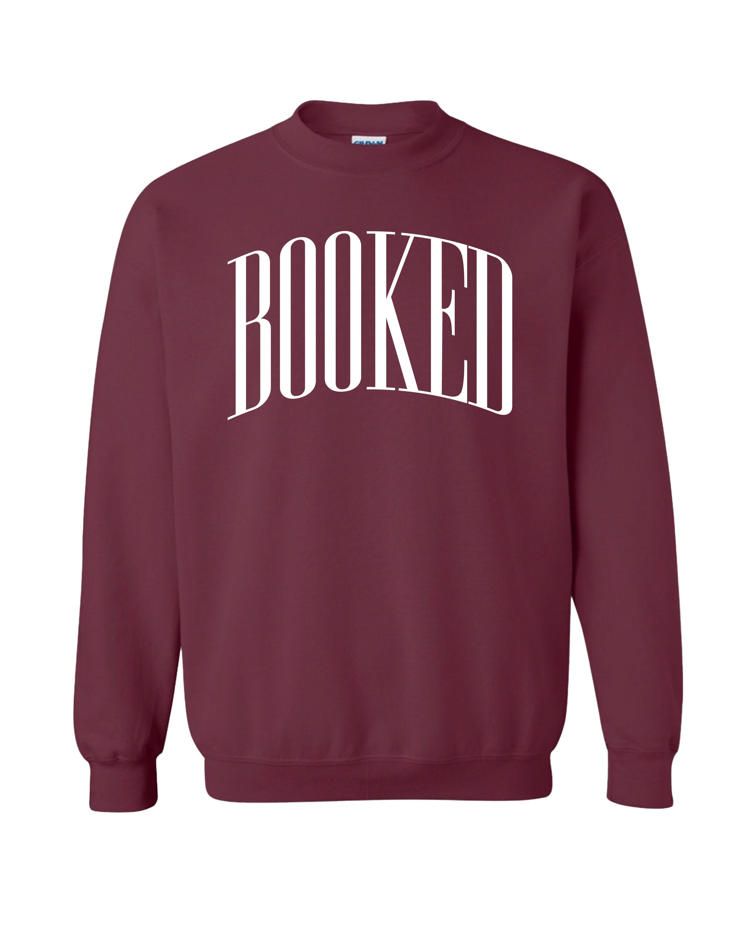 Basic fleece in maroon with 'BOOKED' graphic on chest, shown on flat lay – Little Mama Shirt Shop