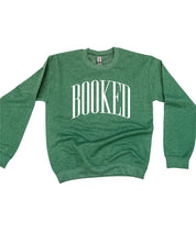 Basic fleece in forest with 'BOOKED' graphic on chest, shown on flat lay – Little Mama Shirt Shop