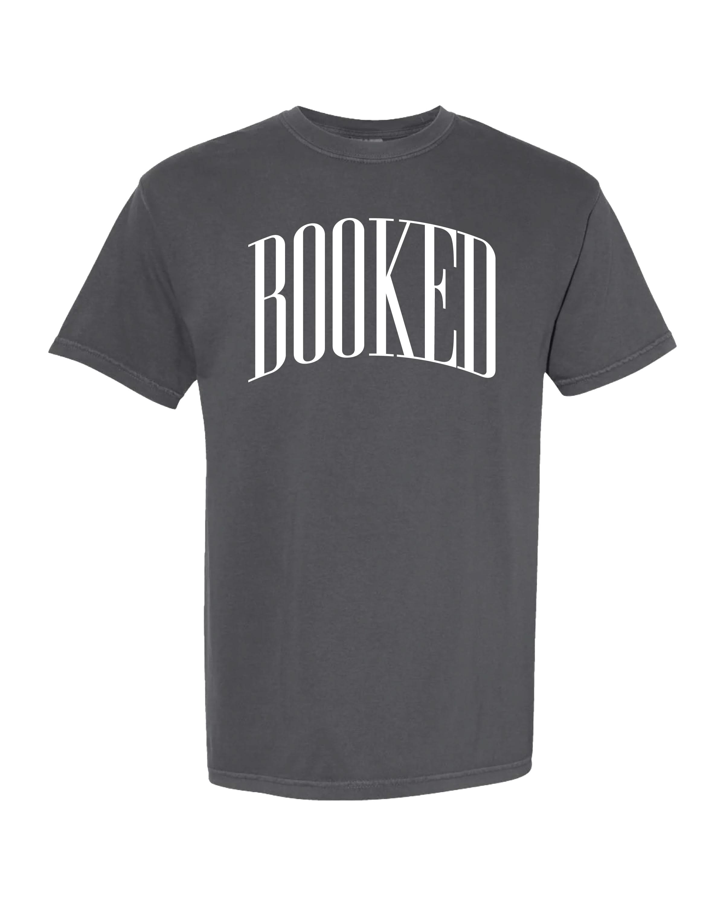 Comfort colors tee in gray with 'BOOKED' graphic on chest, shown on flat lay – Little Mama Shirt Shop
