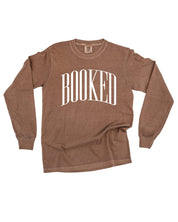 Long sleeve comfort colors tee in espresso with 'BOOKED' graphic on chest, shown on flat lay – Little Mama Shirt Shop
