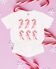 Comfort Colors Tee in white with 6 candy canes on chest, shown on flat lay – Little Mama Shirt Shop