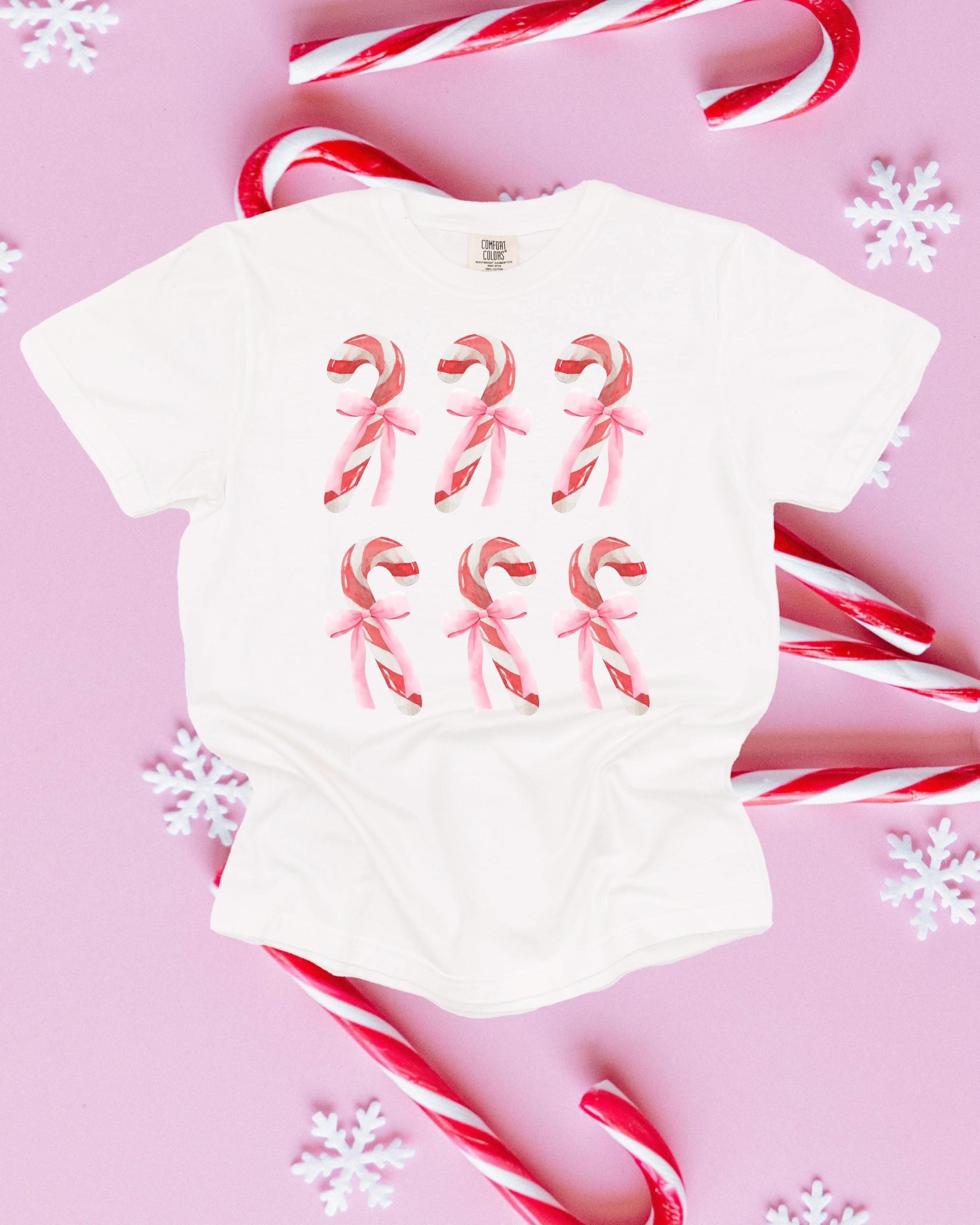 Comfort Colors Tee in white with 6 candy canes on chest, shown on flat lay – Little Mama Shirt Shop