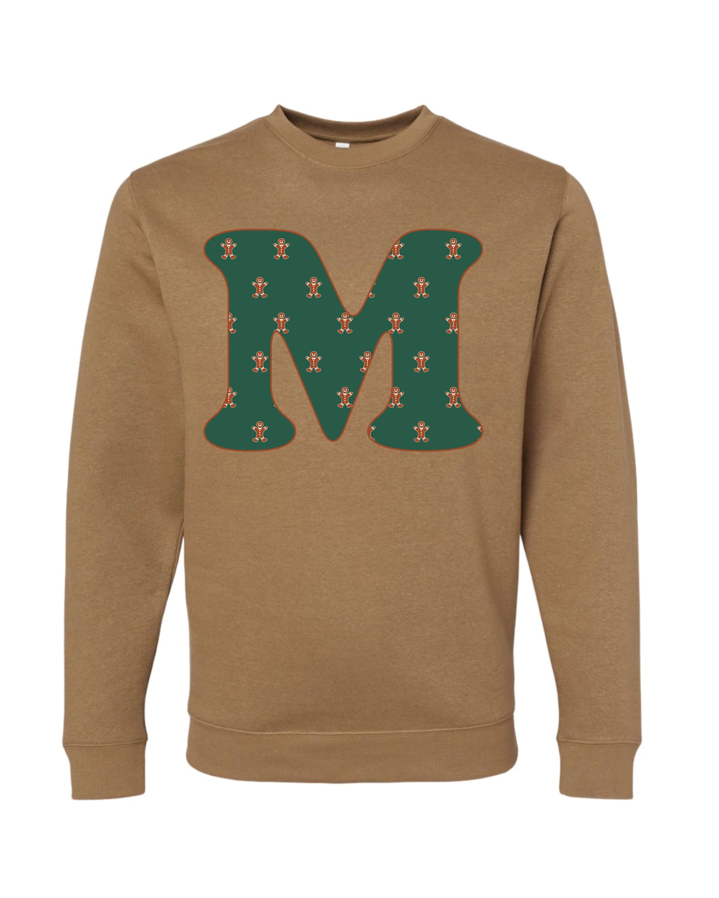 Adult Sweaters in coyote brown with Christmas patterned gingerbread men with initial M on front, shown on flat lay – Little Mama Shirt Shop