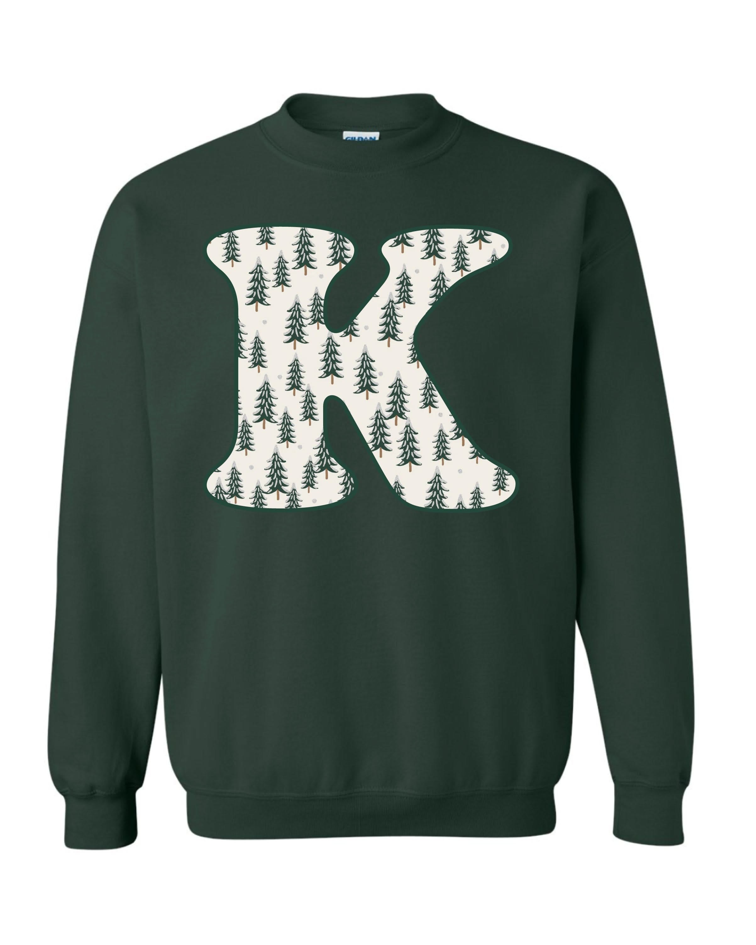 Adult Sweaters in forest with Christmas patterned trees with  initial K on front, shown on flat lay – Little Mama Shirt Shop
