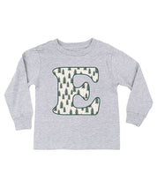 Child long sleeve in white with Christmas patterned trees initial E on front, shown on flat lay – Little Mama Shirt Shop