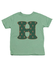 Child tee in sage with Christmas pattern gingerbread men with initial H on front, shown on flat lay – Little Mama Shirt Shop